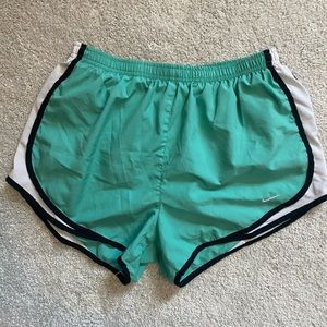 Turquoise and white Nike athletic shorts